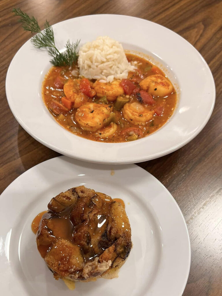 Mouthwatering plate of rice with shrimp and sausage gumbo, paired with a bowl of caramel bread pudding.